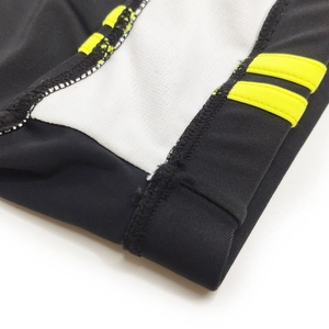 Close-up of sporty swim briefs featuring color-block design and durable flatlock stitching