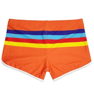 Detail view of orange men's swim trunks featuring multi-color stripes and white edge piping
