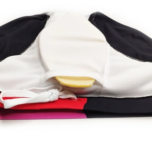 Detail view of men's colorful swim trunks featuring mesh lining and removable yellow pad