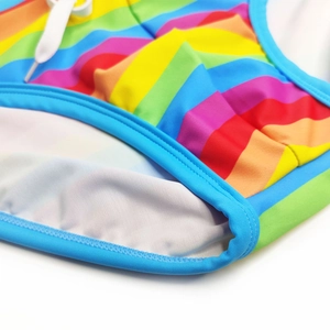 Detail of rainbow striped swimwear featuring high-elastic fabric and blue piping edge