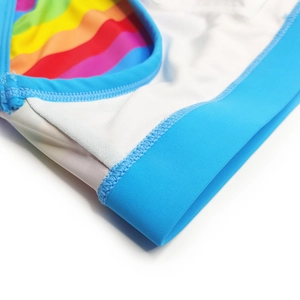 Detail of rainbow stripe fabric with blue elastic trim and professional flat stitching