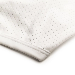 Close-up of white breathable mesh fabric with high-quality flat seam stitching details