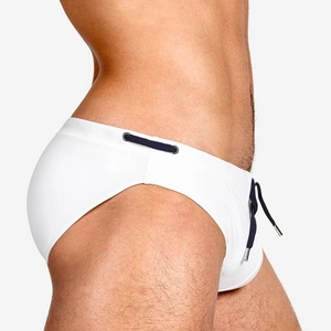 Detail of white men's swim briefs showing quick-dry fabric and navy blue drawstring