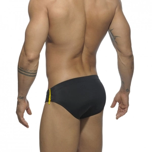 Rear view of black low-rise men's swim briefs with yellow decorative zipper detail