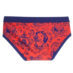 Close-up of red men's swim briefs featuring nautical tattoo prints and navy blue trim detail