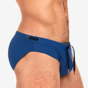 Close-up of men's dark blue swim briefs showing waist drawstring with metal tips