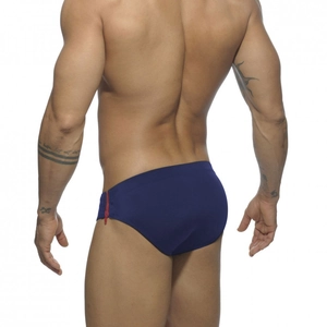 Detail of navy blue swim briefs featuring a functional side zipper and sporty low-rise cut