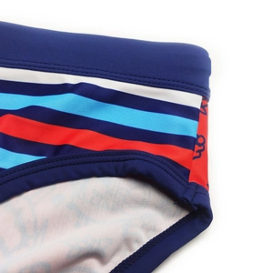 Detail of red and blue striped swimwear with elastic fabric and flat seams
