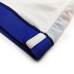 Detailed close-up of double-stitched seams on quick-dry striped swim trunks