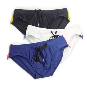 Close-up of three men's swim briefs with side zippers and drawstring in black, white, and blue