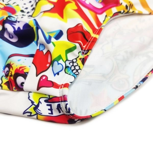 Detailed close-up of vibrant street graffiti print on elastic swimsuit fabric