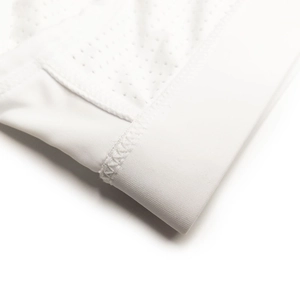Detail of white nylon mesh stitching and flatlock seams on men's breathable swimwear