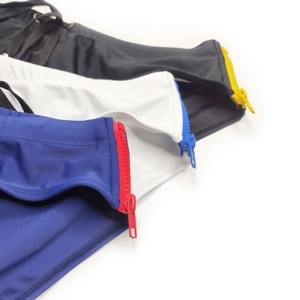 Detail of men's swim briefs with side contrast zippers in black, white and blue colors