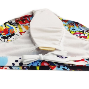 Detail of graffiti swim trunks with inner mesh pocket and removable contour padding