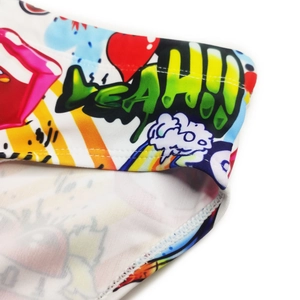 Close-up of graffiti patterns and lip print on quick-dry men swimsuit fabric