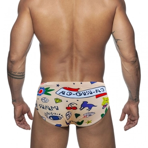 Men's fashion swim briefs with vintage panther tattoo print on beige elastic fabric