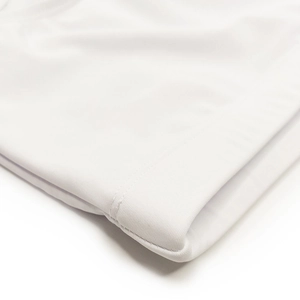 Close-up of high-quality white swimming trunks with fine stitching and soft fabric texture