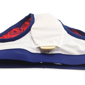 Detail view of men's swim trunks featuring a removable pad insert and red printed lining