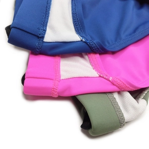 Detail of men's swim briefs showing elastic waistband stitching and white mesh lining