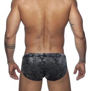 Rear view of men's low-rise swim briefs featuring dark hibiscus tropical floral print