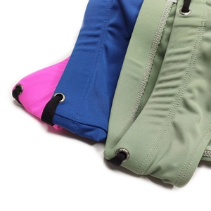Detail of colorful men's swim briefs with elastic waist and metal eyelet drawstring