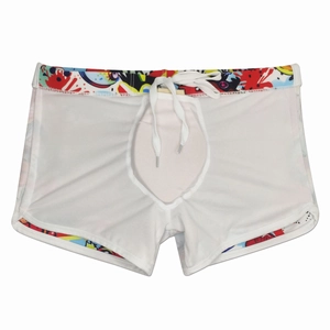 Detail view of cartoon print swimming trunks with breathable mesh lining and drawstring