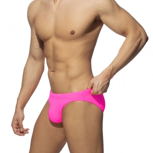 Men's neon pink high-stretch swim briefs with low-rise ergonomic pouch design