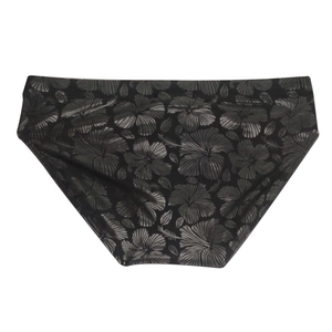 Detailed flat lay of black men's swim briefs with gray tropical hibiscus floral pattern