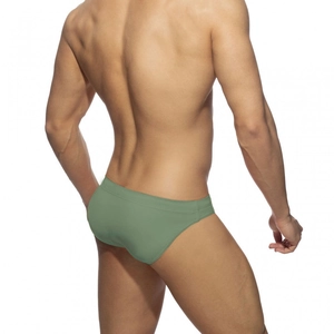 Rear view of men's grass green slim fit swim briefs showing fabric texture and athletic cut