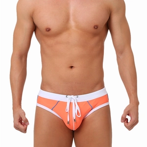 Men's orange swim briefs with white contrast waistband and adjustable drawstrings