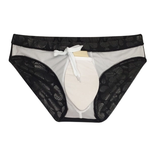 Detail of men's floral swim briefs featuring breathable mesh lining and protective cup pad