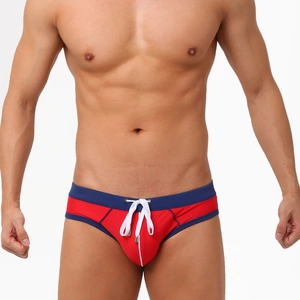Men's low-waist contrast color swim briefs in red and navy blue with white drawstring