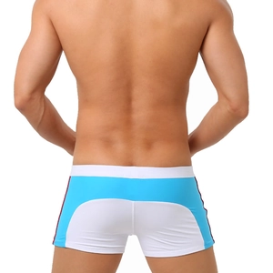Rear view of men's color-block swimming trunks in blue and white with side stripe detail