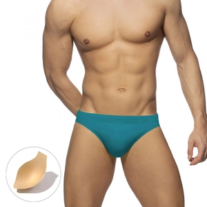 Detailed view of men's turquoise swim briefs with removable contouring pad detail