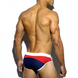 Rear view detail of men's color-block swim briefs showing tight fit and elastic fabric
