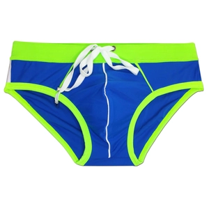 Detail of color-block swim briefs with neon green edges and adjustable drawstrings