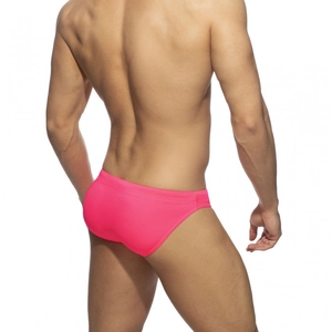 Rear view of bright pink elastic swim briefs showing full coverage and low-rise athletic cut