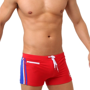 Men's red swim trunks with tricolor stripes, zipper pocket, and white drawstring cords
