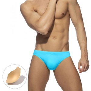 Close-up of bright blue men's swim briefs with a removable foam cup pad for shaping