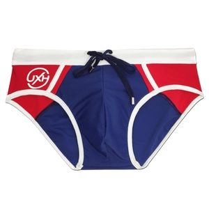 Detail of men's tricolor swim briefs with elastic waistband and navy blue drawstring cord