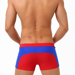 Rear view of tight men's swim trunks featuring a red and blue color-block design