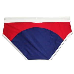 Detailed view of color-block swim briefs in red, blue, and white elastic fabric