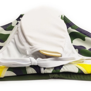 Detail of camouflage swim briefs featuring inner pocket with removable sponge padding