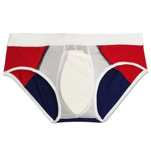 Detail of color-block swim briefs with contrast red, white, and navy panels and padded pouch