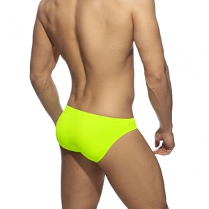 Rear view of fluorescent yellow men's low-rise swim briefs in high-elasticity fabric