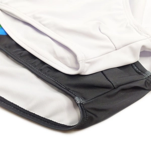 Detail view showing black and white nylon fabric texture and reinforced seam stitching