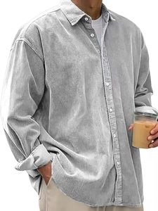 Detailed view of grey corduroy shirt texture with classic buttoned collar and ribbed fabric