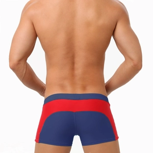 Rear view of men's color-block swimming trunks in red and blue high-stretch quick-dry fabric