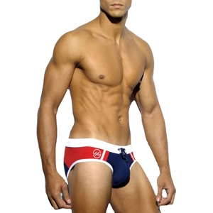 Men's low-waist bikini swimming briefs with color-block design in red, blue, and white