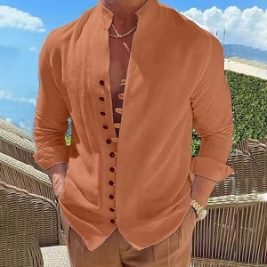 Detail of men's orange linen mandarin collar shirt with dark buttons and casual fit